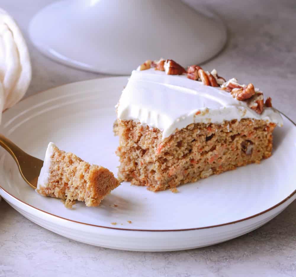 A bite of healthy carrot cake on a fork.