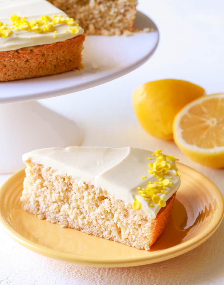 a slice of lemon cake with lemon cream cheese frosting (no butter)