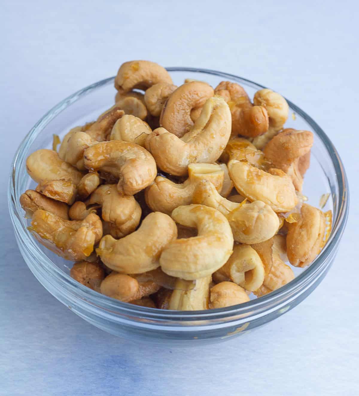 Maple roasted cashews in a glass bowl