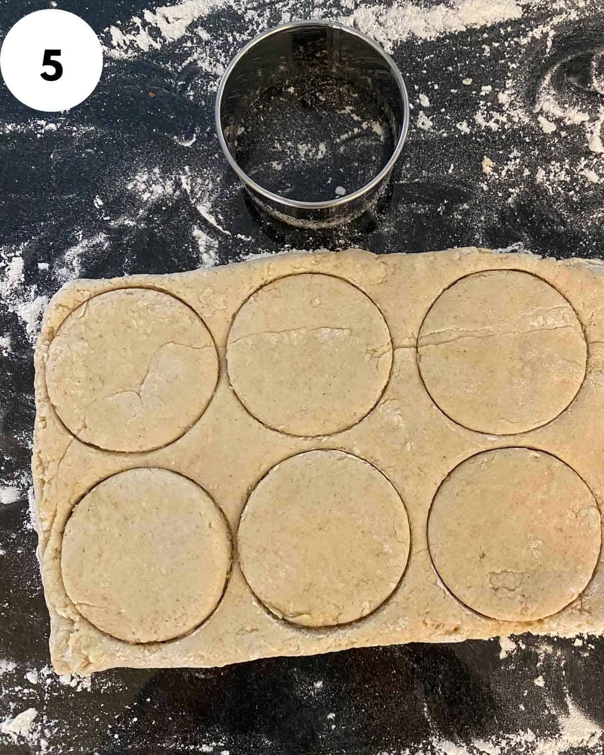 biscuits being cut from dough