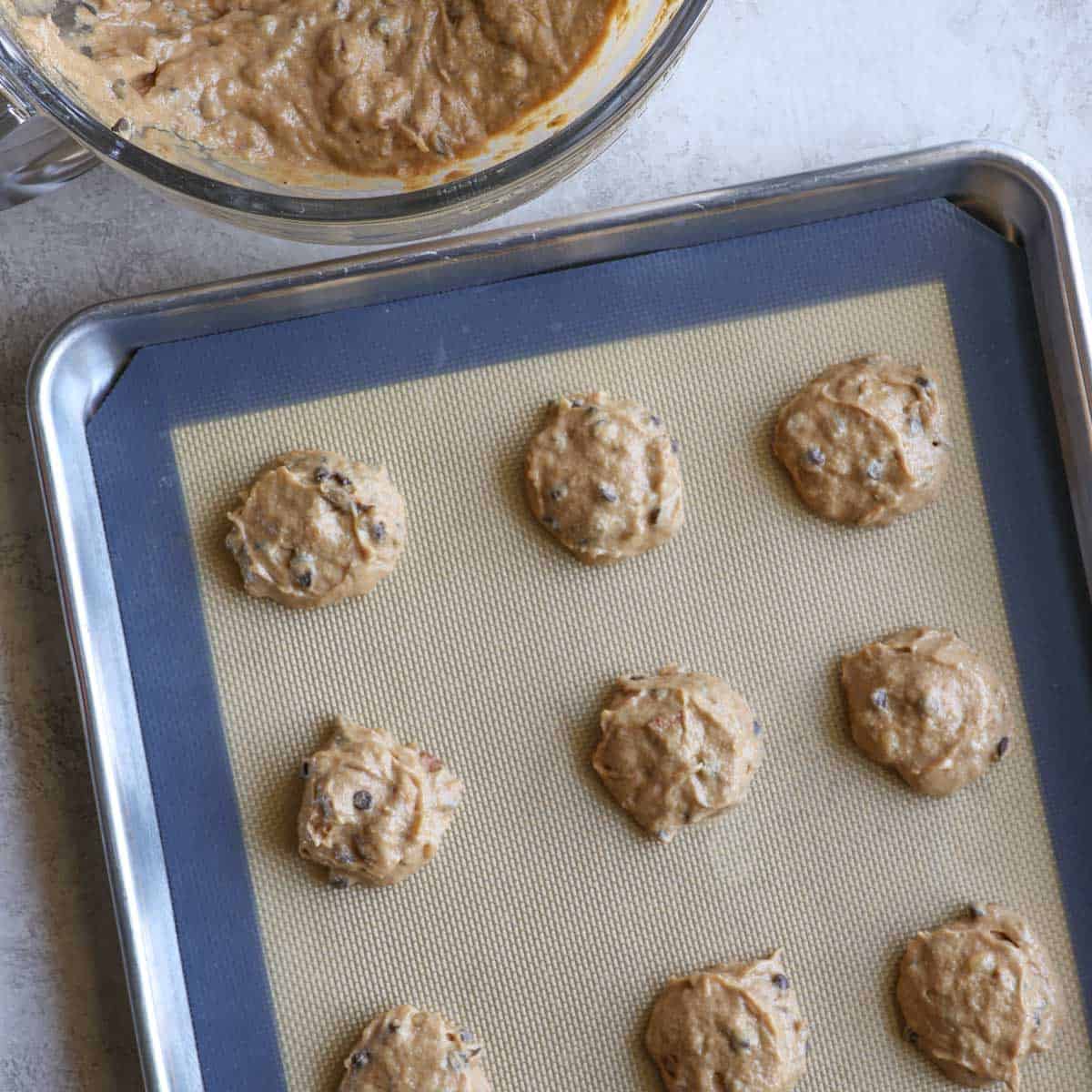 cookie dough on a baking sheet before baking 