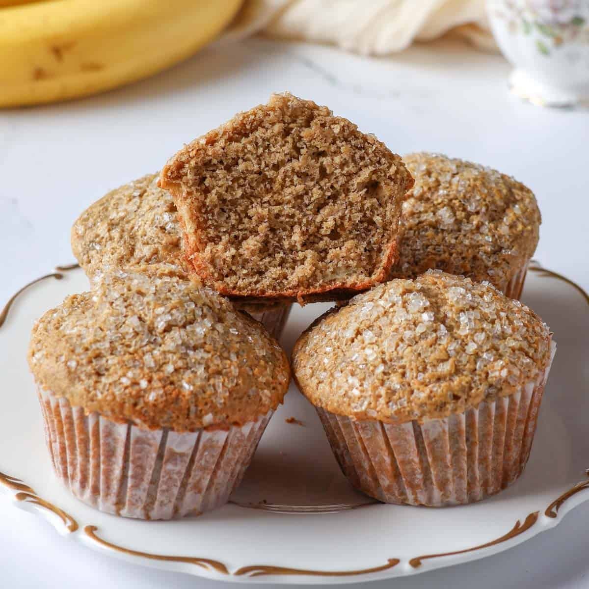 Inside of a fluffy oat flour banana muffin showing a soft, tender crumb