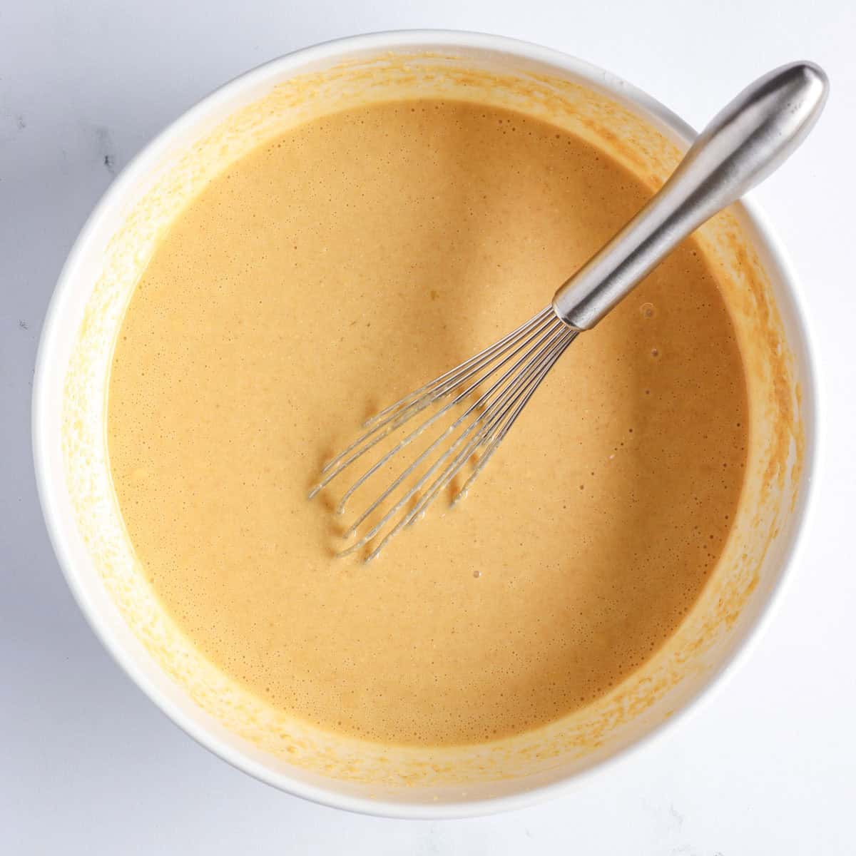 shortcake cake batter made with oat flour, smooth and slightly thick in a mixing bowl