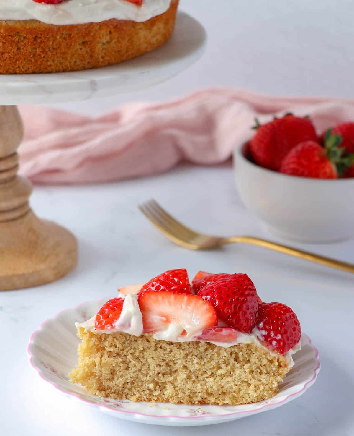 Healthy strawberry shortcake made with oat flour and topped with maple yogurt cream and fresh strawberries