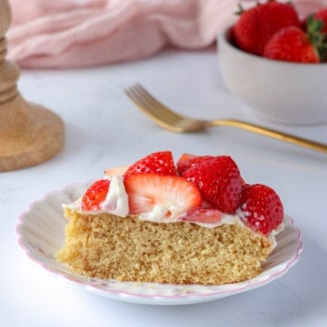 Healthy strawberry shortcake made with oat flour and topped with maple yogurt cream and fresh strawberries