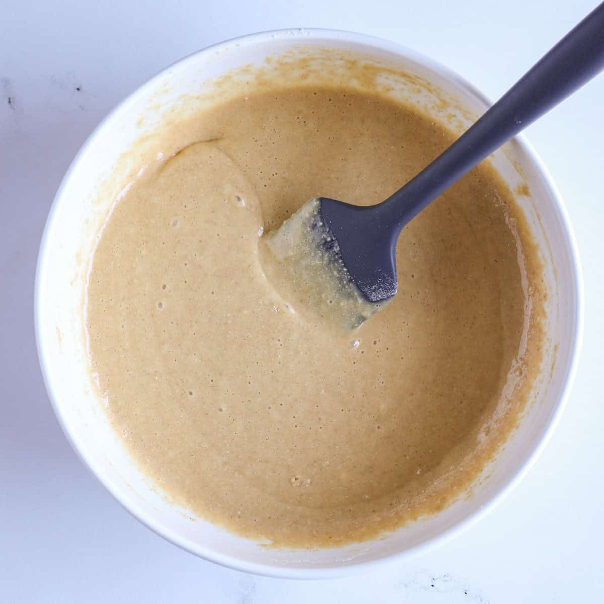 protein cake batter in mixing bowl