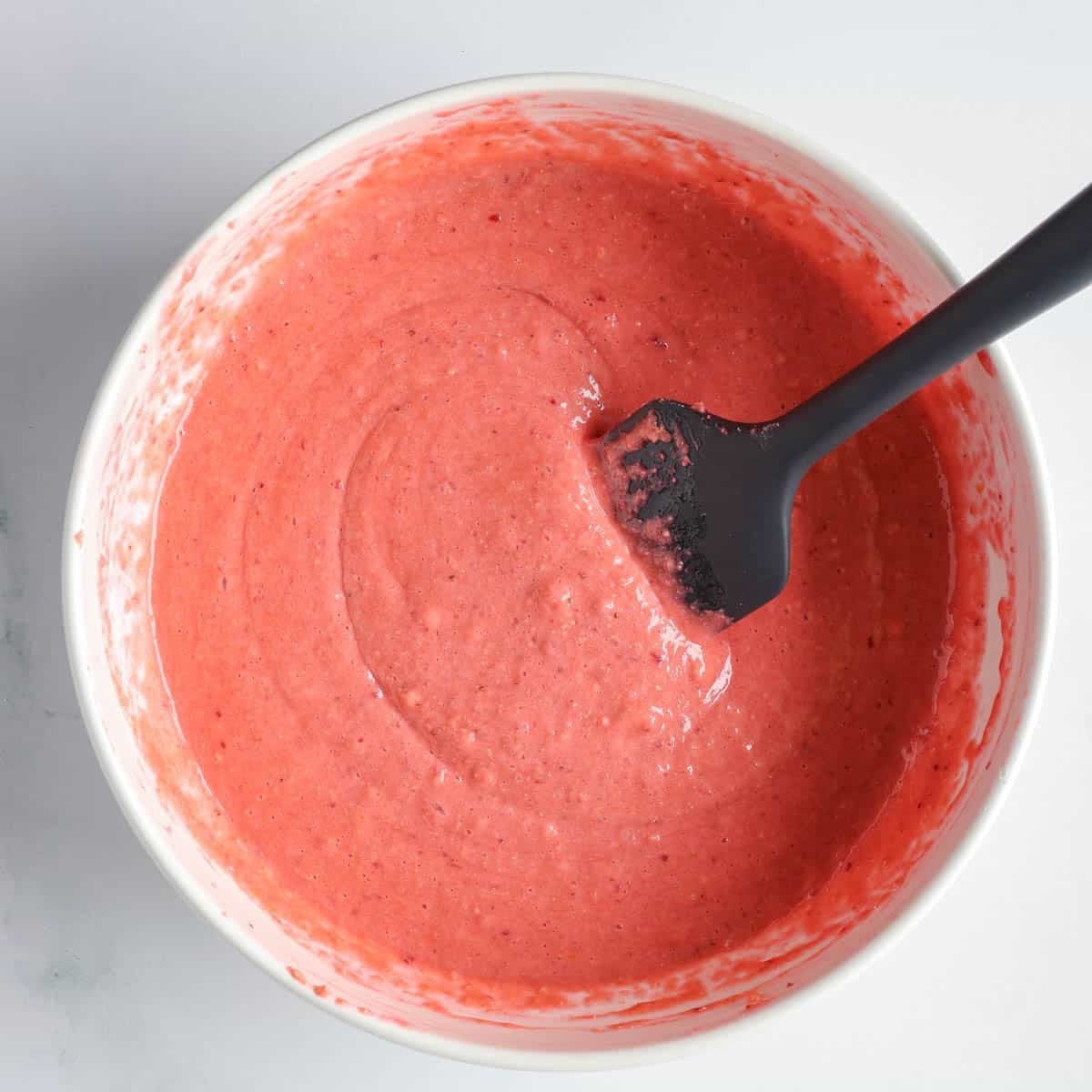 Strawberry protein bar batter mixed and ready for baking