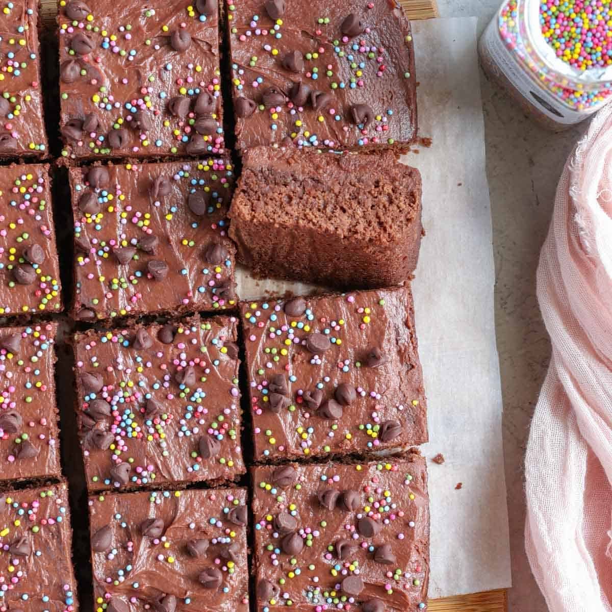 protein brownies with frosting and sprinkles cut into squares
