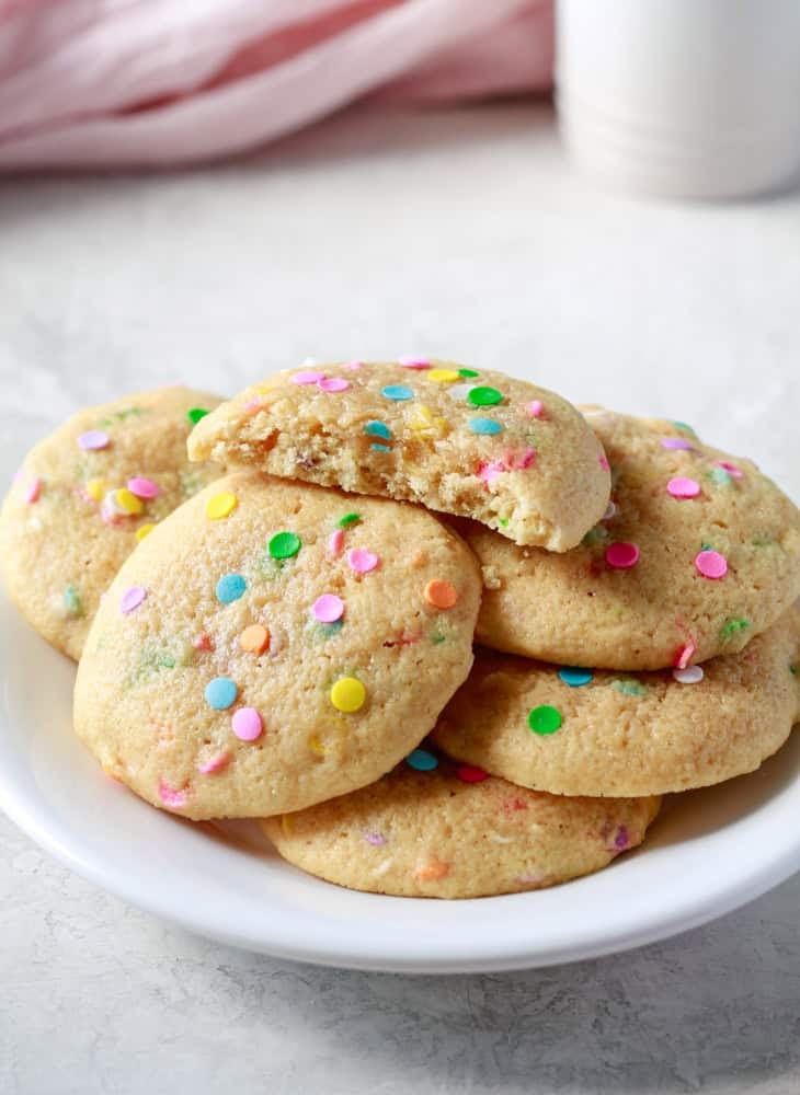 Birthday cake protein cookies on a white plate
