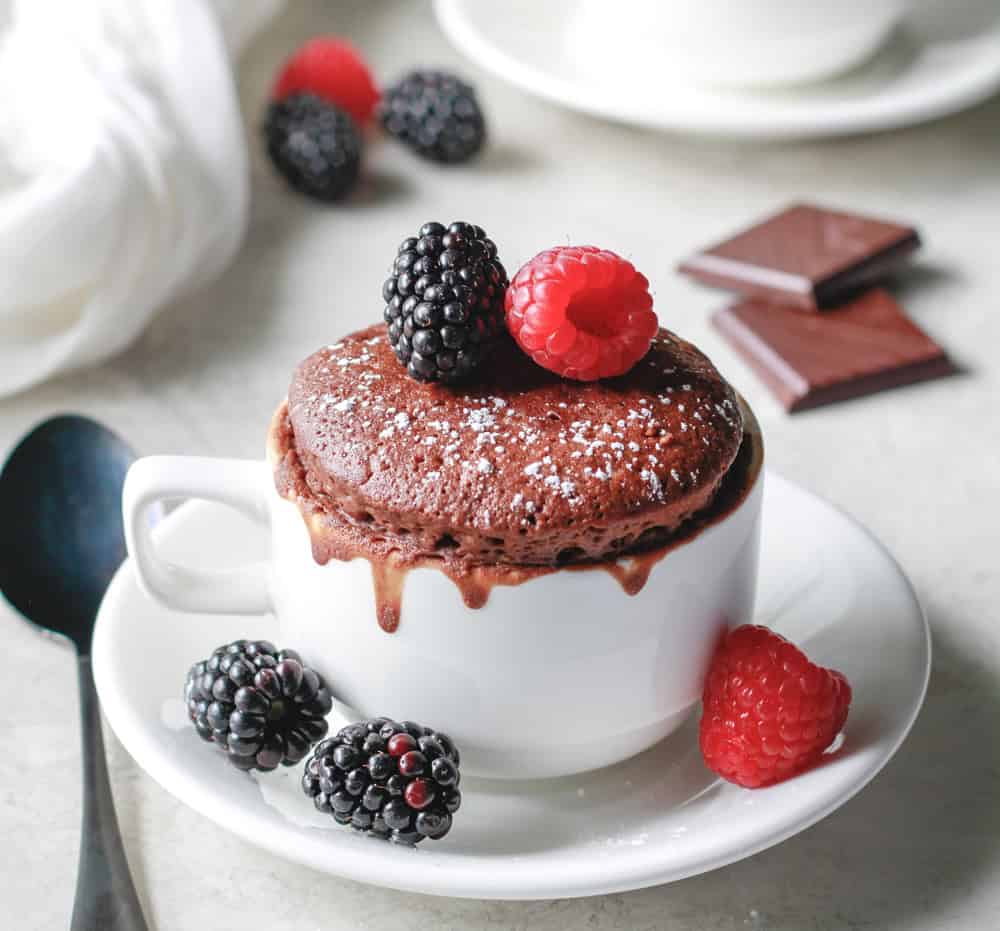 chocolate protein mug cake topped with berries