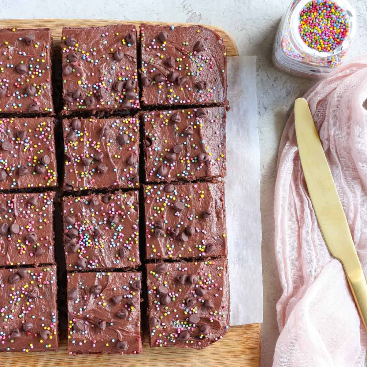 healthy cosmic protein brownies topped with sprinkles and mini chocolate chips