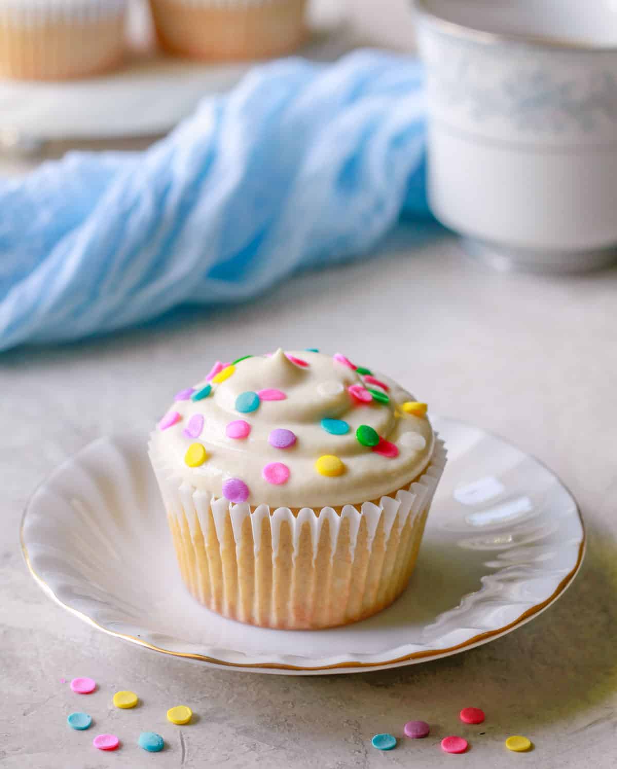 Vanilla protein cupcake with cream cheese frosting and sprinkles