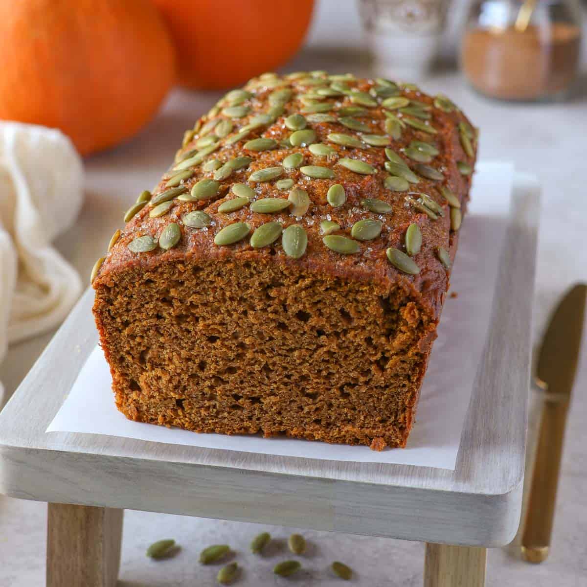 Protein pumpkin bread topped with pumpkin seeds
